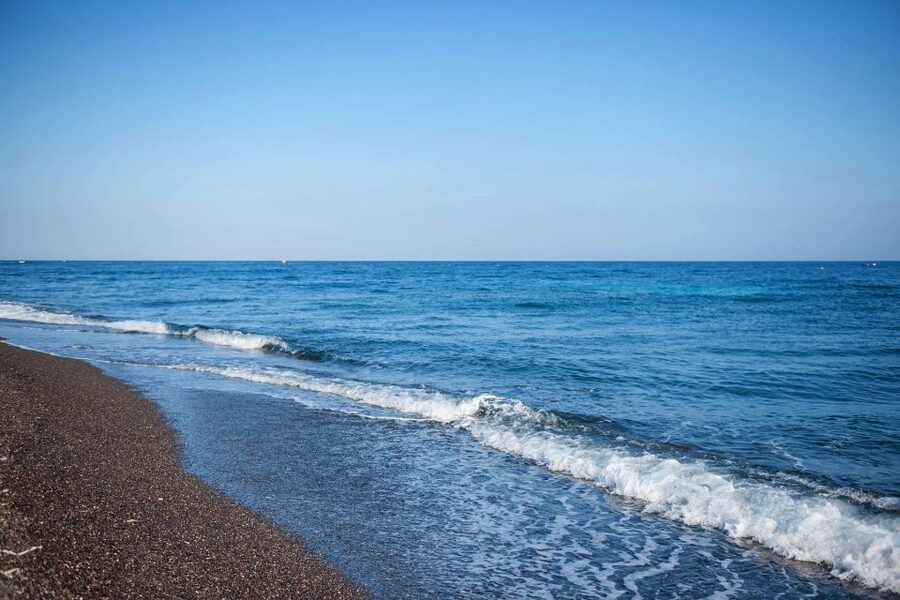 Discover Santorini: Prehistoric Akrotiri & Winery Tour - The whitewashed village lanes and black-sand beach time