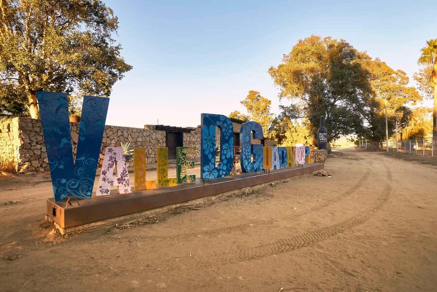 From Tijuana: Valle de Guadalupe Shared Winery Tour - The Big Bottle, the iconic sign, and a quick local market moment