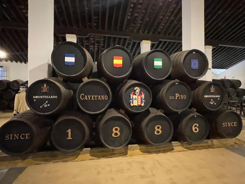 Jerez de la Frontera: Sherry Winery Tour with Tasting - Entering the 1886 Winery: Labels, Barrels, and Cool Air