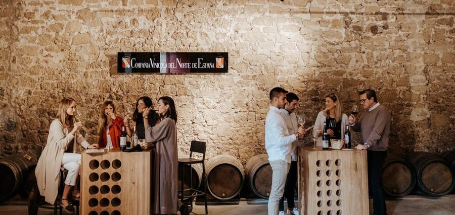 La Rioja: Guided visit to CVNE Winery and wine tasting - Walking into CVNE’s historic spaces and barrel-filled caves