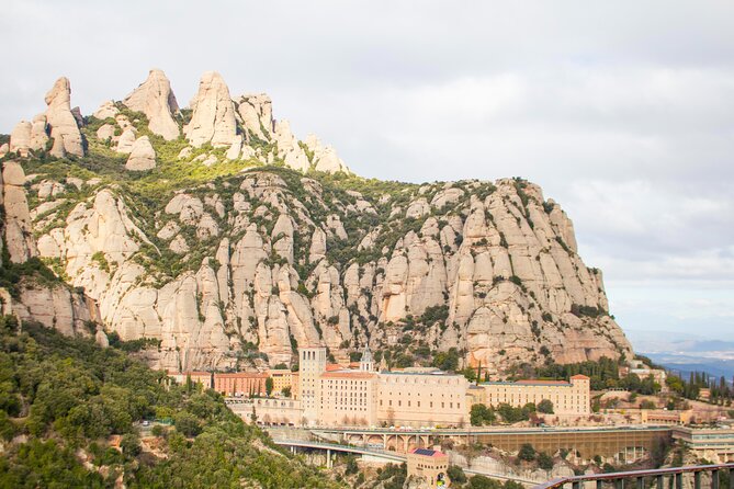 Montserrat Full Day Tour with Farmhouse Lunch and Winery Visit - La Moreneta, the Basilica, and the Monastery Life Feeling