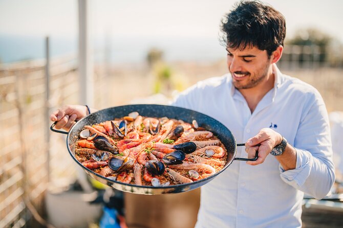 Paella Cooking Experience & Winery Tour from Barcelona - Paella cooking class: hands-on time that ends with dinner