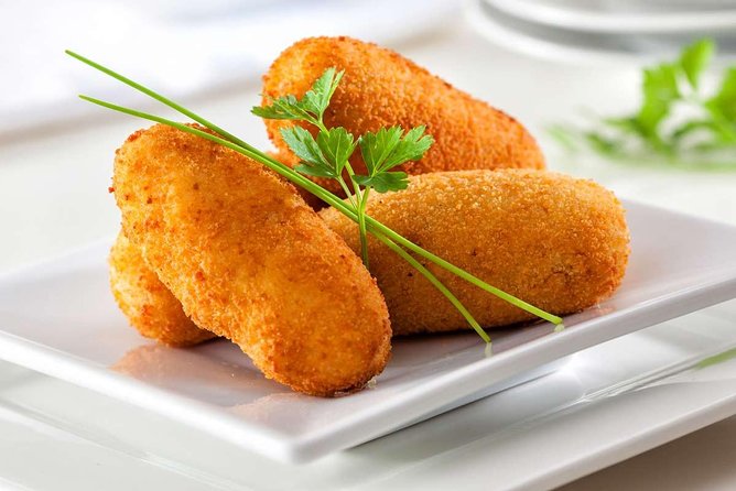 PREMIUM TAPAS TOUR: Paella, Tapas, Winery and Flamenco - Plaza del Siglo: Fish Specialties, Croquettes, and Cooking Shows