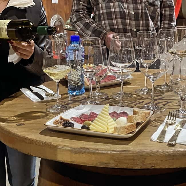 The largest winery in Montenegro: private tour & transport - The tasting lineup: four wines, white and red, with a Montenegrin plate